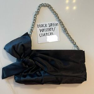 Black satin wristlet/clutch with silver chain for sale. Good condition.